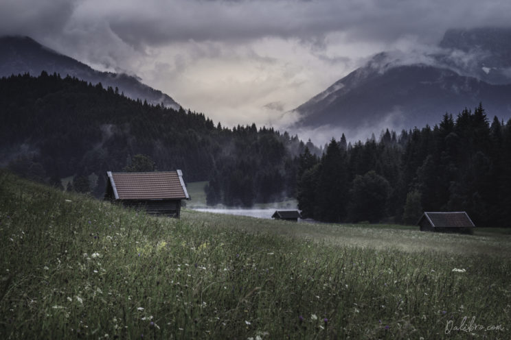 Another view of the Geroldsee Valley with alpine cabins scattered around the meadow (long lens)