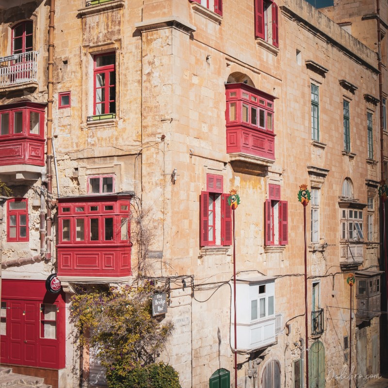 This one is not only a beautiful building covered with cute little red balconies but also a bar called Bridge bar.