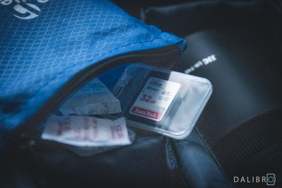 I carry a couple of SD cards with me so that I can do a kind of backup by swapping them. Silica gel bags reduce the humidity.